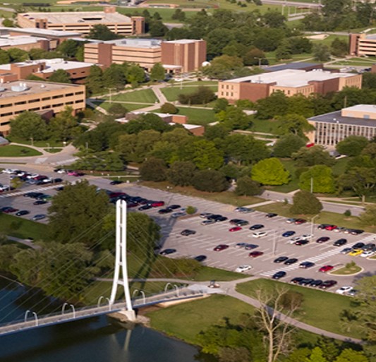 view of IU Fort Wayne campus with foot-bridge in foreground